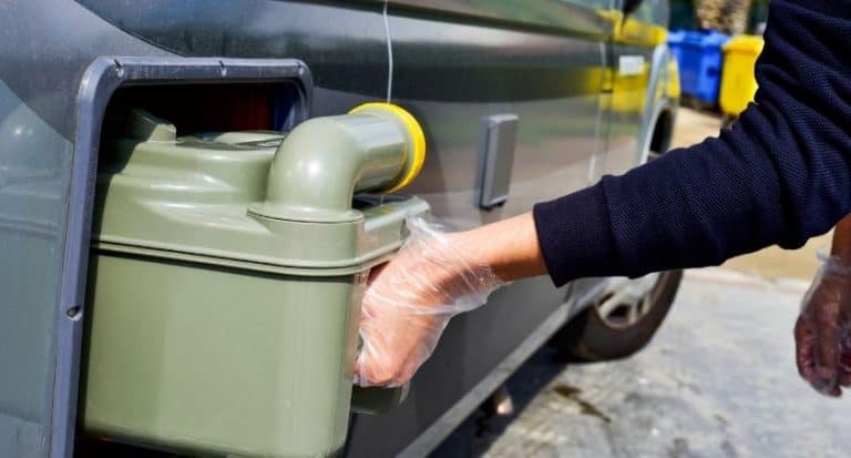 toilet cassette being bulled from campervan