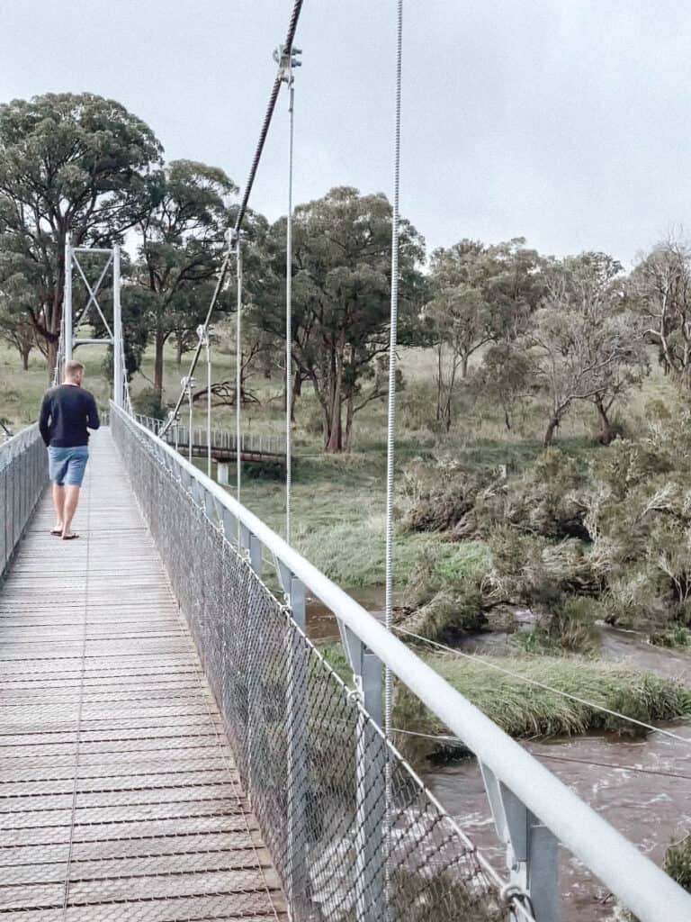 Wade walking over the suspension bridge