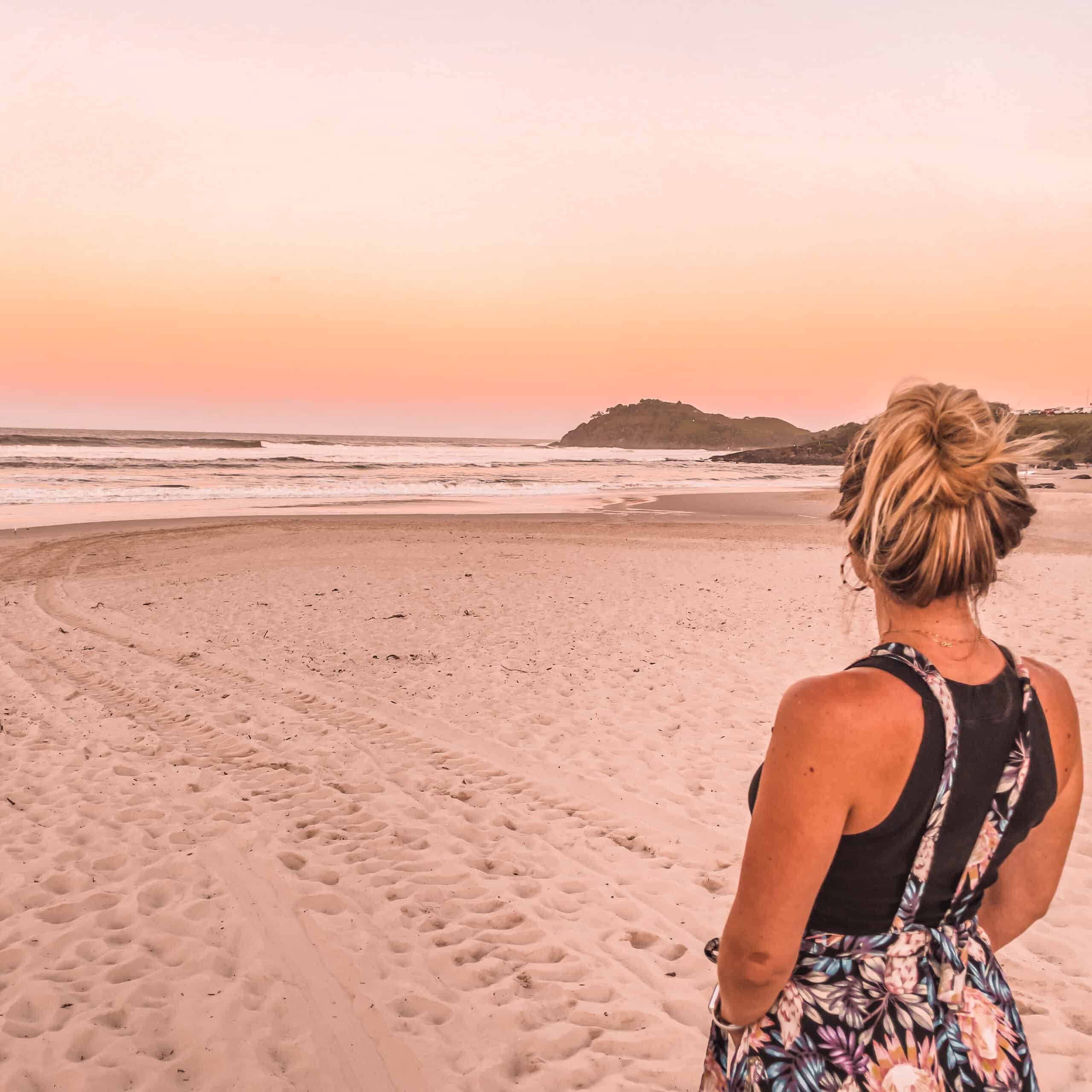 Dani standing at a beach