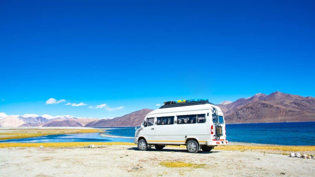 Camper van with the mountains in the background