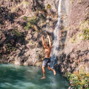 Wade jumping into Attie Creek Falls