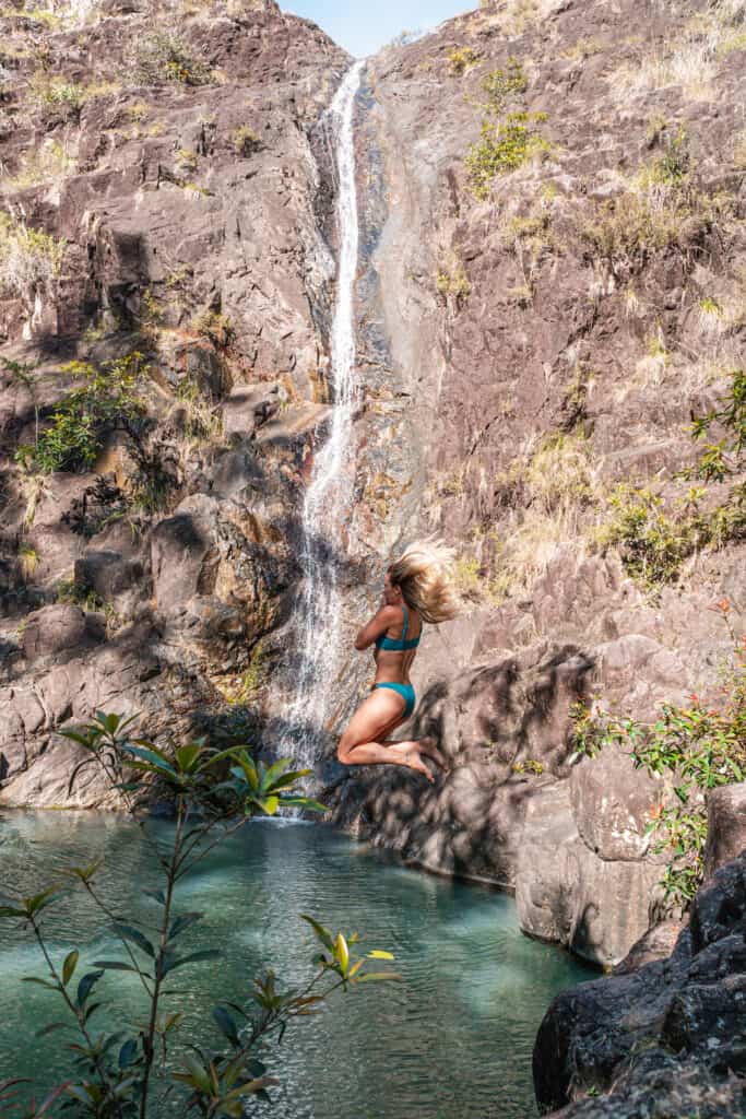 Dani jumping into Attie Creek Falls