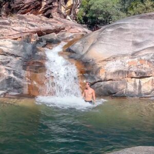 Wade under the waterfall at Big Crystal Creek