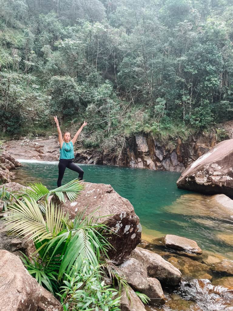 Dani standing at the Wheel of Fire at Finch Hatton Gorge