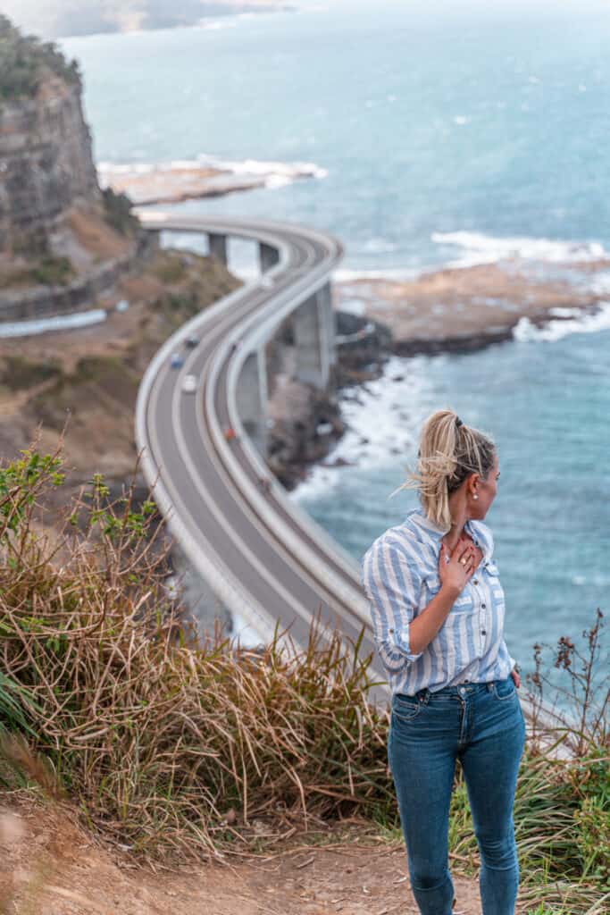 Dani standing at the Secret Sea Cliff Bridge Lookout 