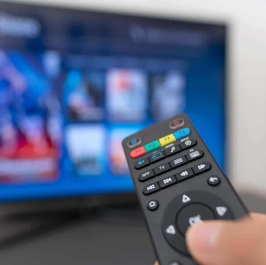 Remote with a blurring TV in the background