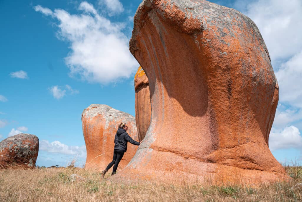 Dani touching a rock at  Murphy's Haystacks