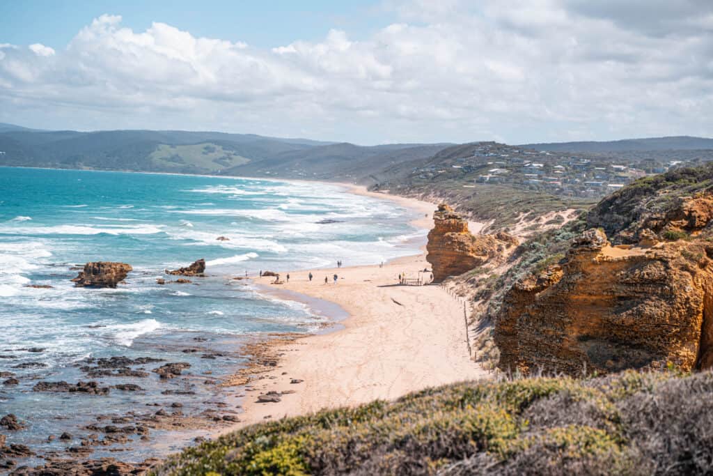 Views of a beach surrounded by cliffs at Split Point Lighthouse