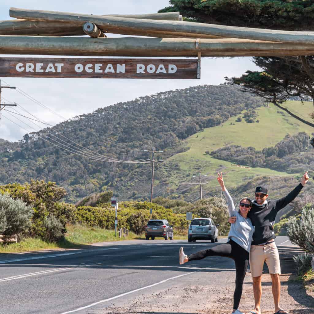 Wade and Dani standing in front of the Great Ocean Road Memorial Arch