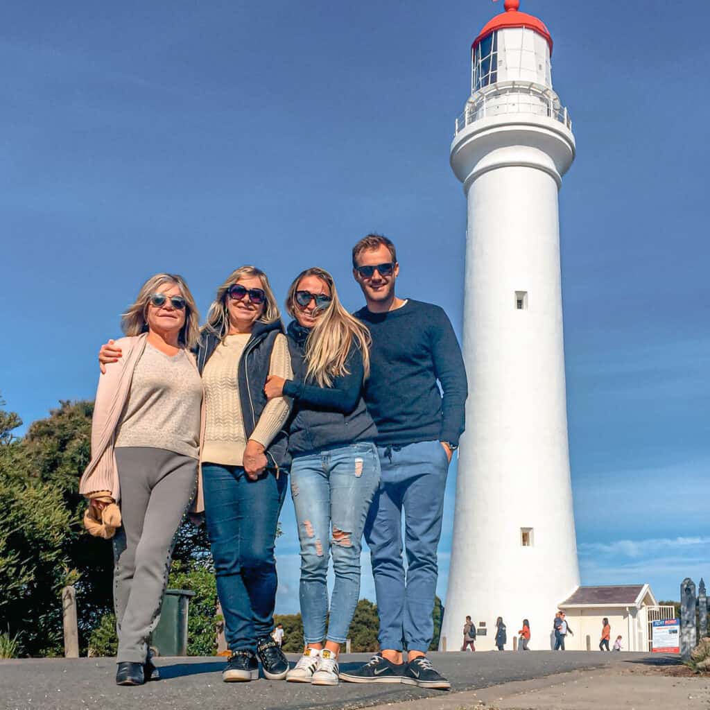 Dani and Wade with Dani's mom and aunty standing in front of the Split Point Lighthouse