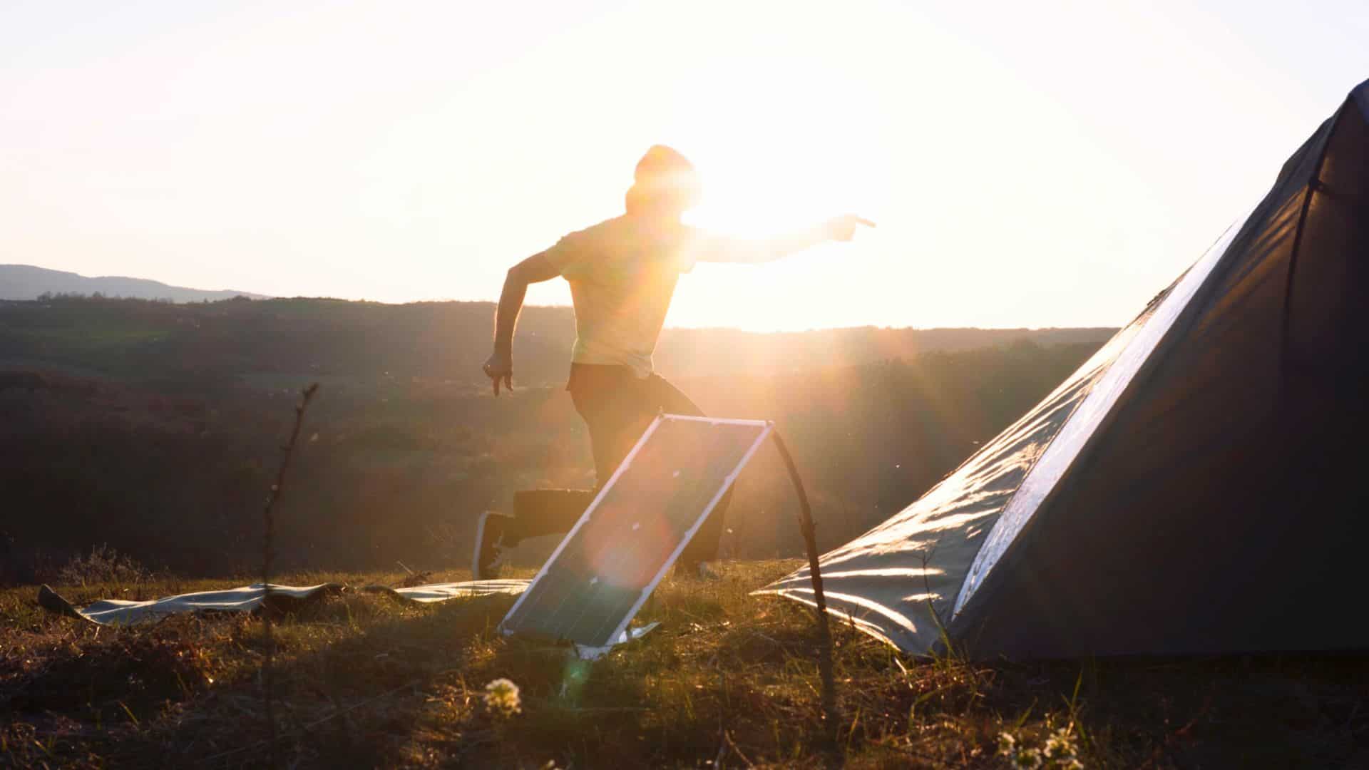 man with portable solar panel