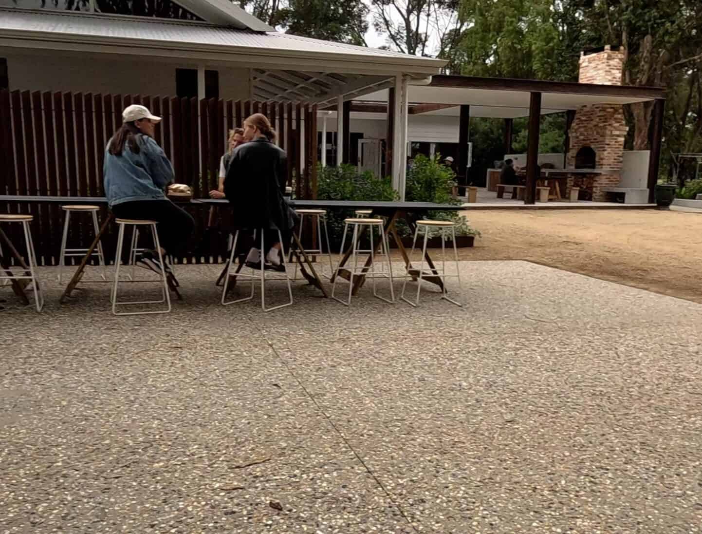 A few people sitting at a table at Bread Local Bakery in Esperance