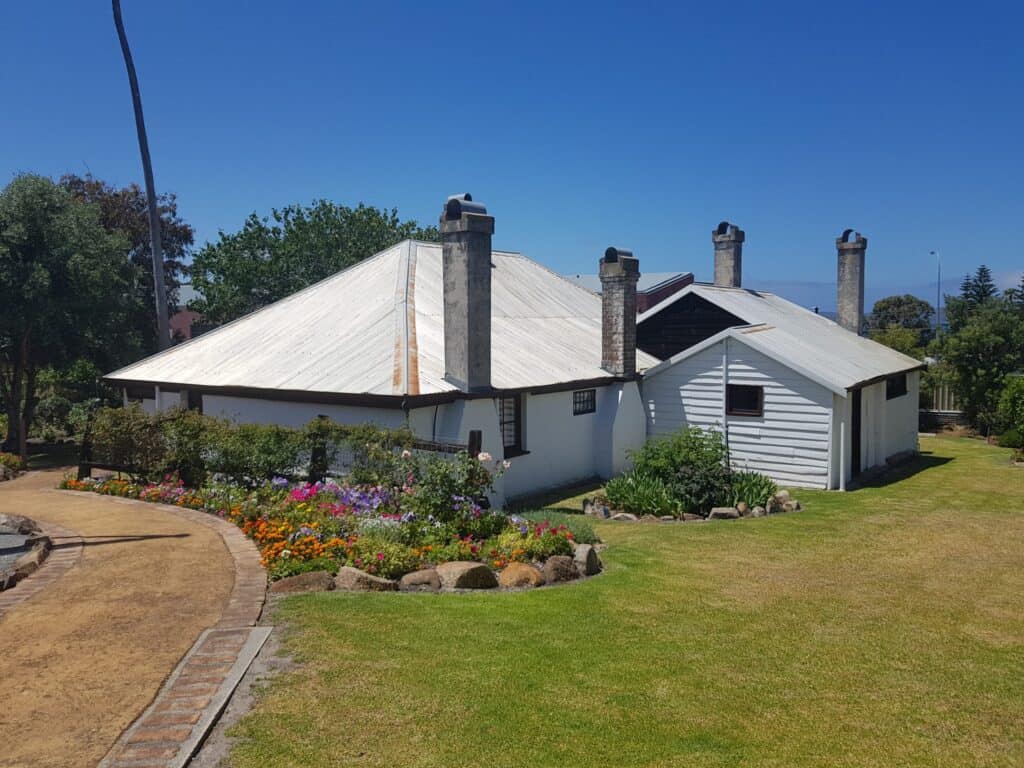 A picture of an old house, it is actually Patrick Taylor Cottage