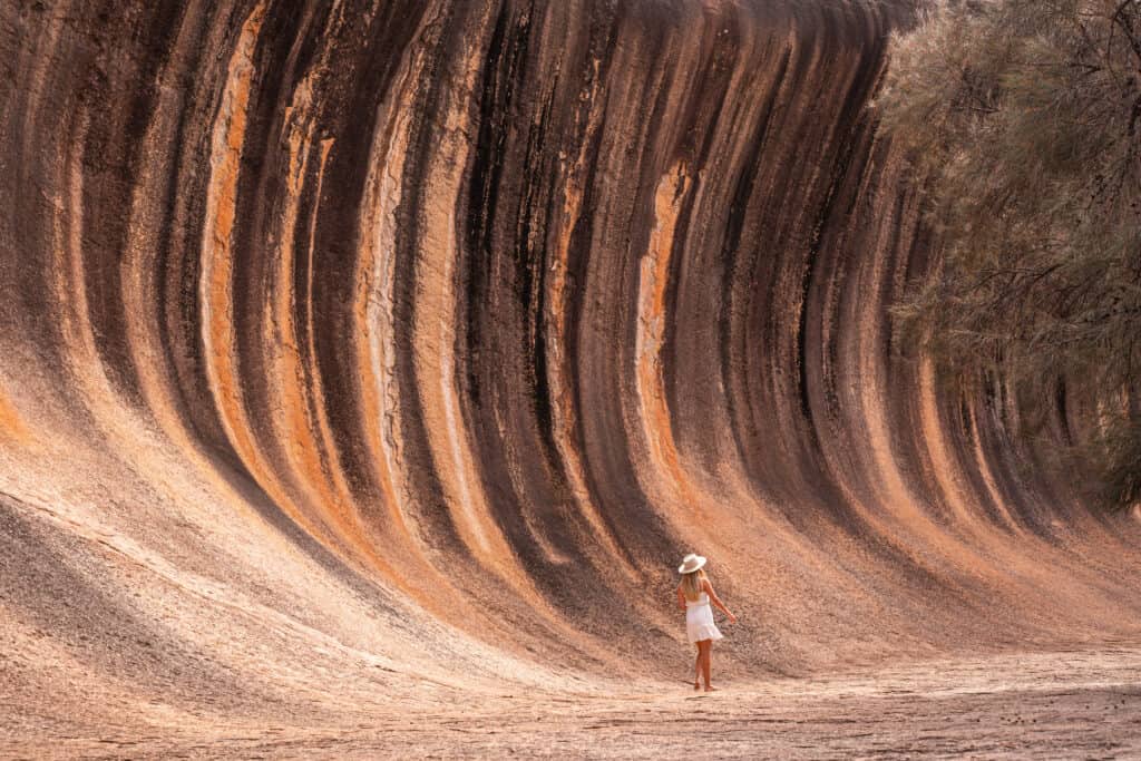 Dani standing at the bottom of the Wave Rock