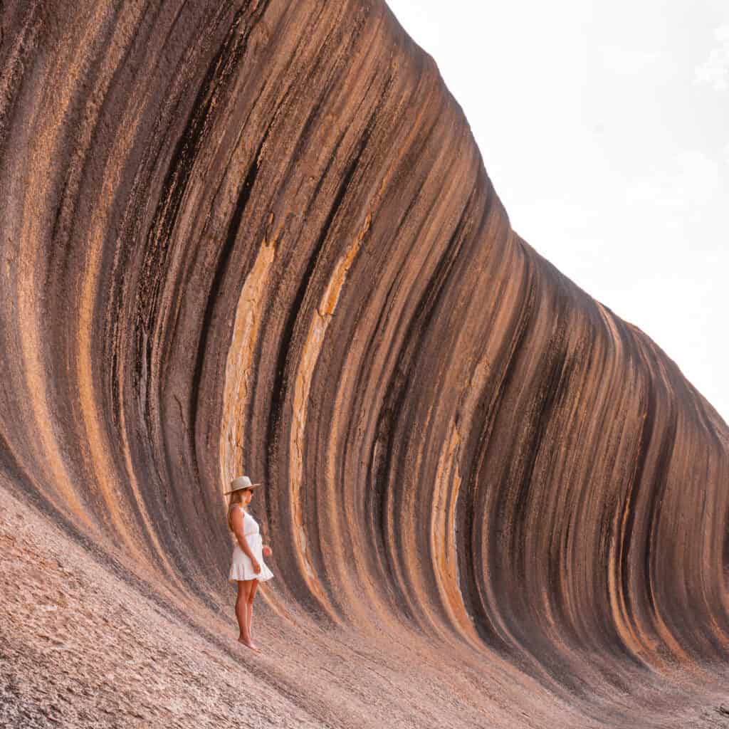 Dani standing at the bottom of the Wave Rock