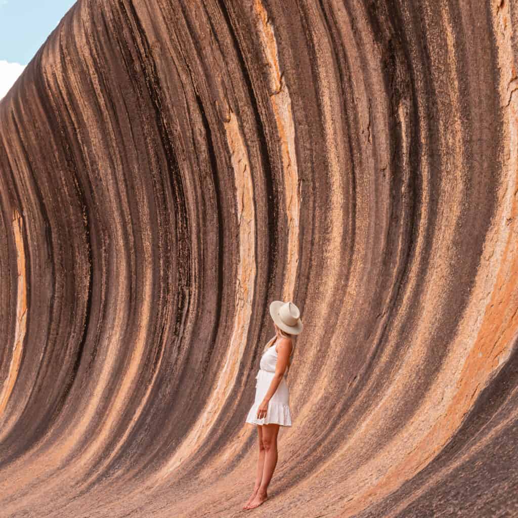 Dani standing at the bottom of the Wave Rock