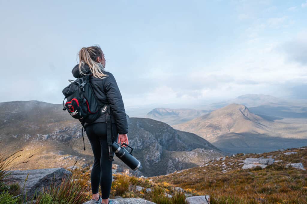 Dani standing on top of Bluff Knoll and appreciating the view