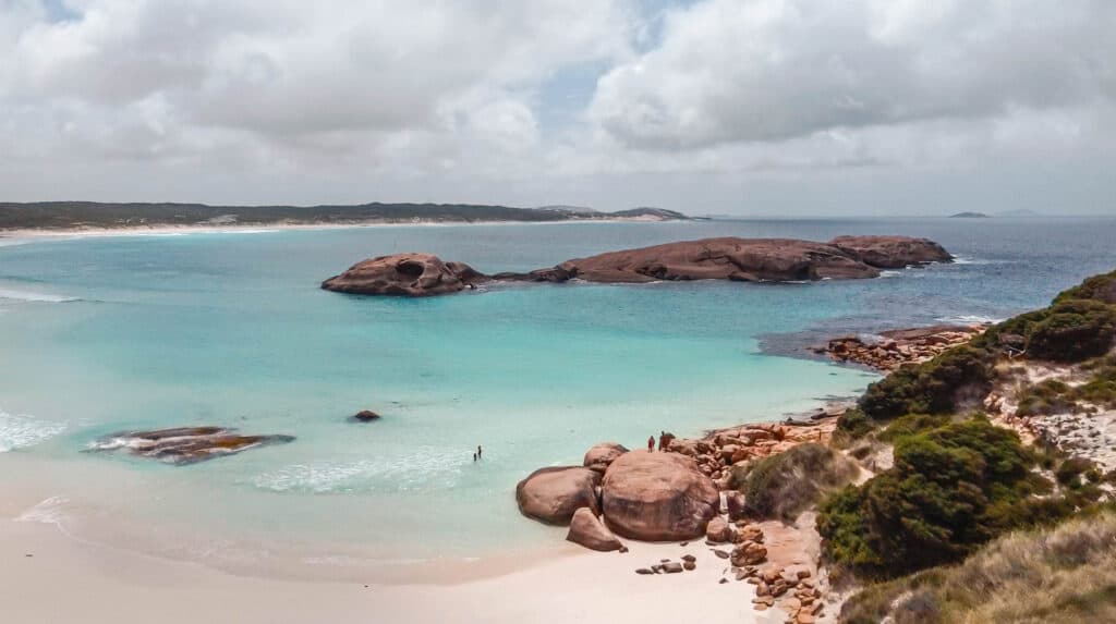 A wide beach with white sand and turquoise water at Twilight Beach