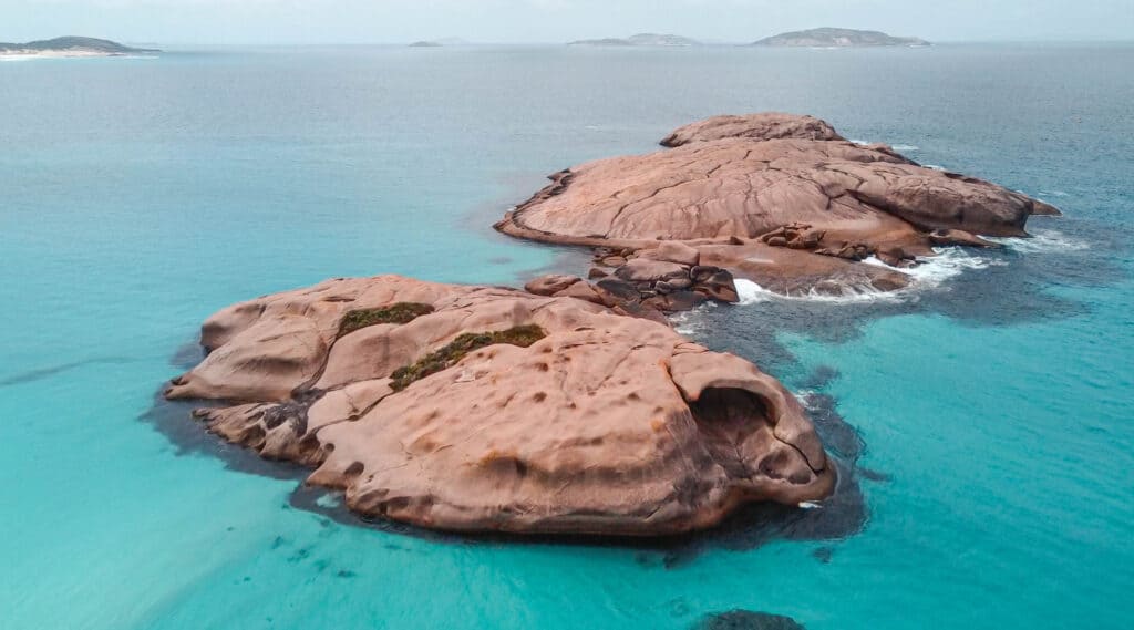 A giant rock in the middle of the crystal clear ocean at Twilight Beach 