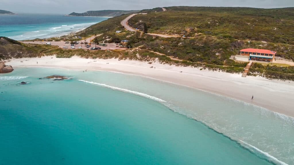 A wide beach with white sand and turquoise water at Twilight Beach