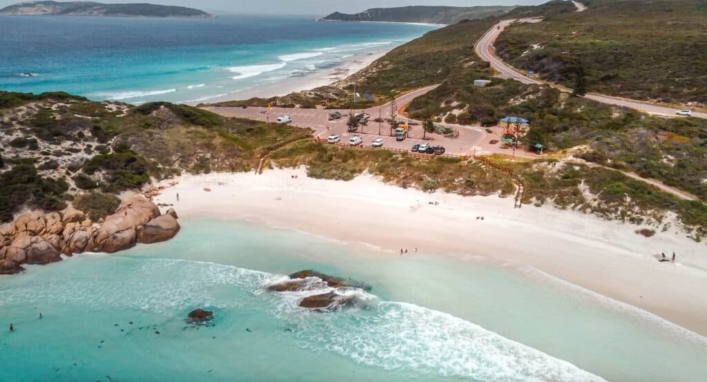 A wide beach with white sand and turquoise water at Twilight Beach