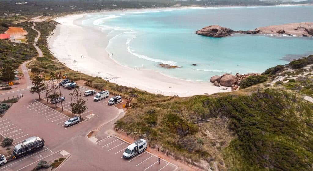 An over view of the car park at Twilight Beach that also shows the white sand and the turquoise water