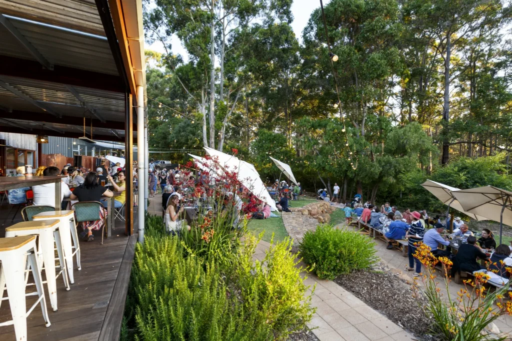 A picture of Margaret River Brewhouse full of people sitting on tables and enjoying the end of the day