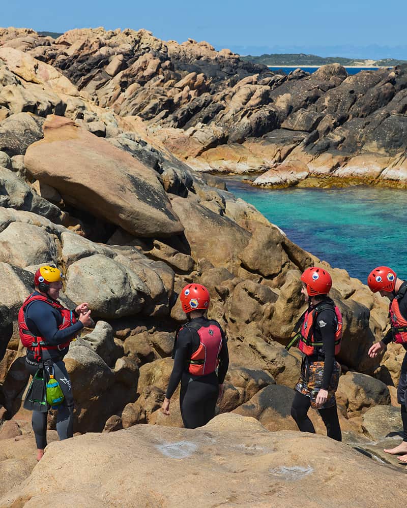Image of a group of people practicing Coasteering