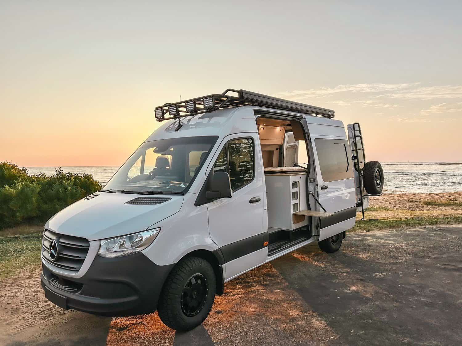 mercedes sprinter camper van with sunset