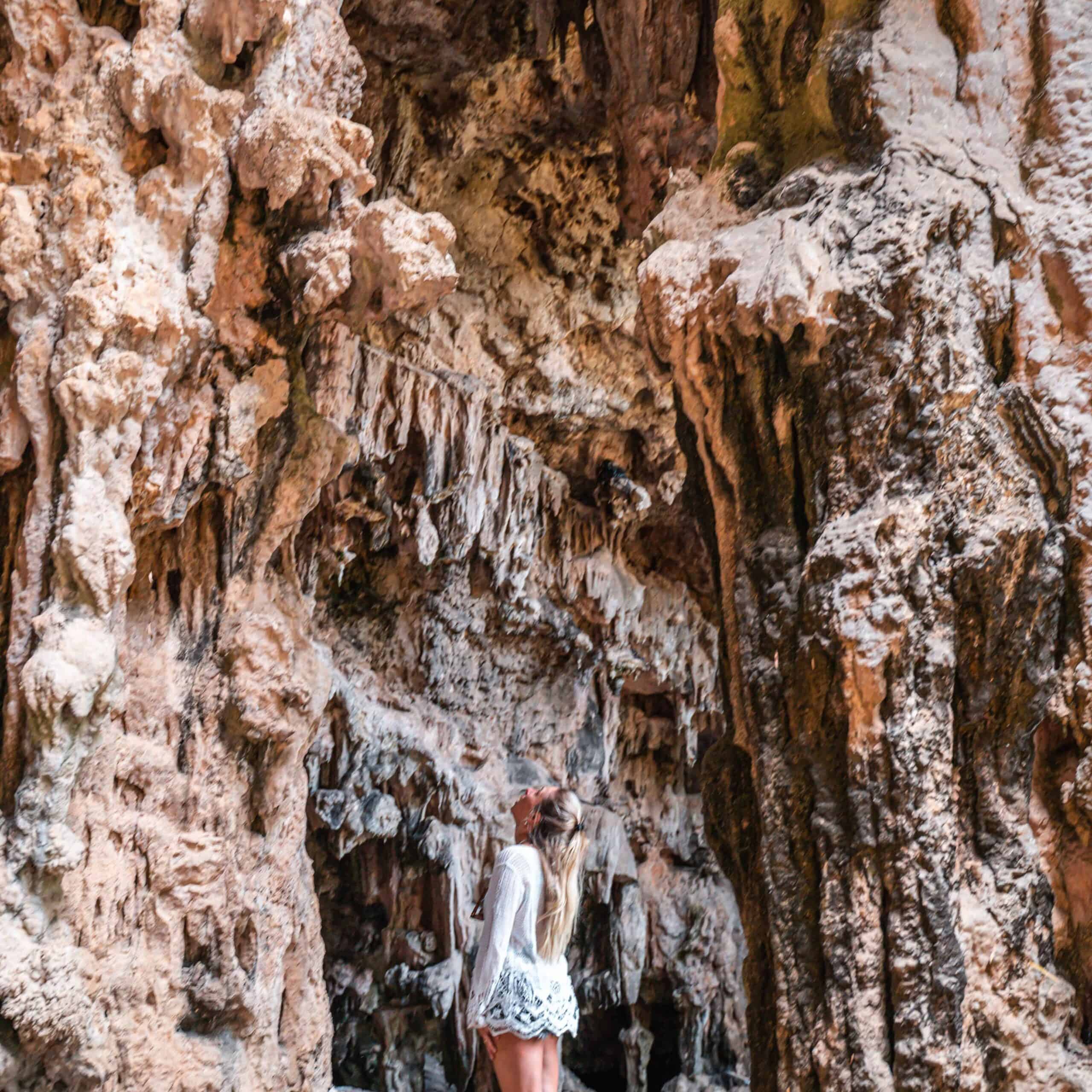 Dani looking up at the free cave in Margaret River